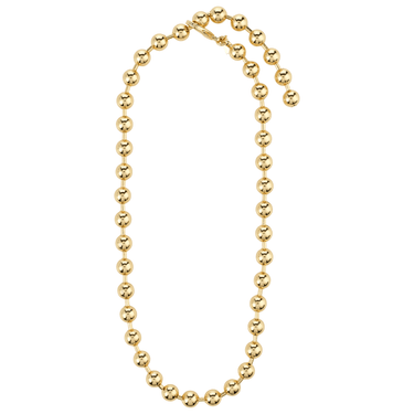 Gold beaded necklace on a white background