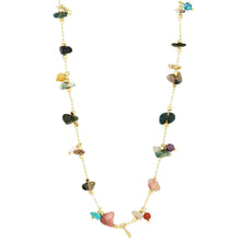 A gold chain necklace featuring a series of small, colorful raw gemstone chips in various shapes and colors, displayed on a clean white background.
