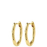 A pair of polished gold huggie hoop earrings with a textured, organic wavy surface, shown against a solid white background.