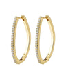 A pair of gold hoop earrings with a row of clear pavé-set stones along the front edge, shown against a plain white background.