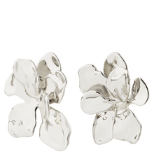 Silver floral earrings on a white background