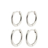 Four pairs of silver hoop earrings on a white background