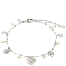 Silver bracelet with various charms and pearls on a white background