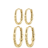 Set of gold hoop earrings on a white background