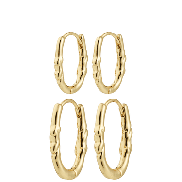 Set of gold hoop earrings on a white background