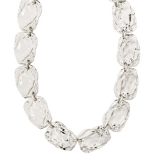 Silver bracelet with clear gemstones on a white background