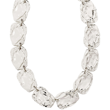 Silver bracelet with clear gemstones on a white background
