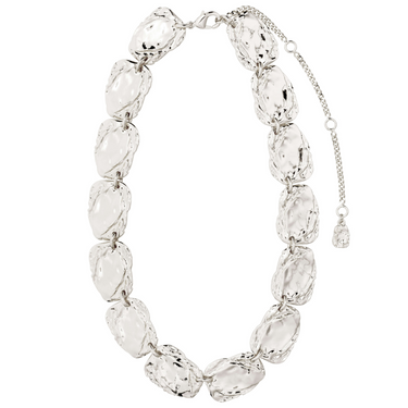 Silver necklace with hammered discs on a white background