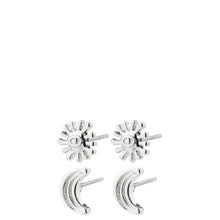 A set of four silver-toned stud earrings, including two sunburst flower designs and two crescent moon designs, displayed on a solid white background.