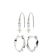 A pair of silver hoop earrings with organic, irregular wavy edges and a pair of matching silver fishhook earrings with a small white pearl dangle, shown on a plain white background.