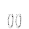 A pair of polished silver hoop earrings with a textured, hammered finish, shown against a solid white background.