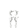 A set of four silver-toned earrings, including two textured crescent moon studs and two matching dangle earrings with textured crescent moon charms, a small crystal link, and a dangling white pearl bead.