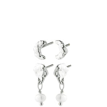 A set of four silver-toned earrings, including two textured crescent moon studs and two matching dangle earrings with textured crescent moon charms, a small crystal link, and a dangling white pearl bead.