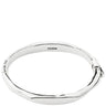 A polished silver-toned bangle bracelet with a textured, organic wavy edge and a small clasp on the side. The brand name 'PILGRIM' is engraved inside the band, shown against a plain white background.