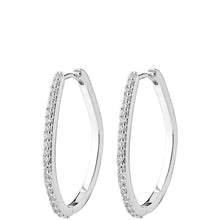 A pair of silver-tone hoop earrings embellished with small clear pavé stones along the front edge, shown against a plain white background.