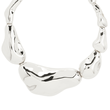 Silver necklace with a unique design on a white background