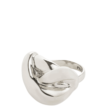 Silver ring with a wavy design on a white background