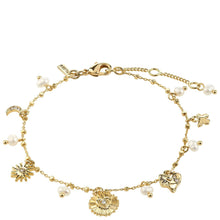 Gold bracelet with various charms on a white background