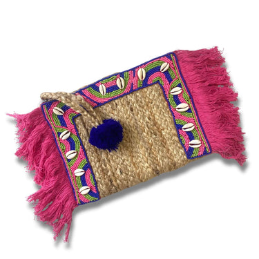Woven pouch with pink fringe and colorful patterns on a white background