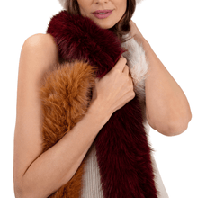 Woman wearing a multicolored fur scarf on a white background