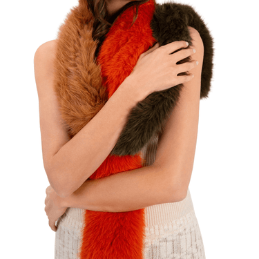 Person wearing a fur scarf with orange, brown, and black colors on a white background