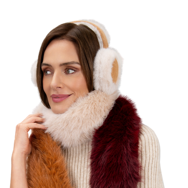 Woman wearing a fur-trimmed headband and scarf on a white background