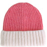 A ribbed knit beanie hat with a heathered coral pink top half and an off-white folded cuff bottom half, shown on a plain white background.