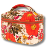 Floral patterned cosmetic bag with a red zipper on a white background