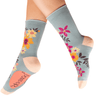 Gray socks with colorful floral patterns on a white background