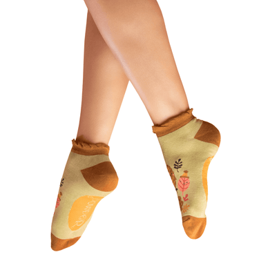 Decorative socks with floral patterns on a white background