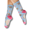 Light blue socks with animal pattern worn by a person on a white background