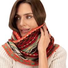 Woman wearing a patterned scarf on a white background