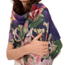 Woman wearing a floral patterned scarf on a white background