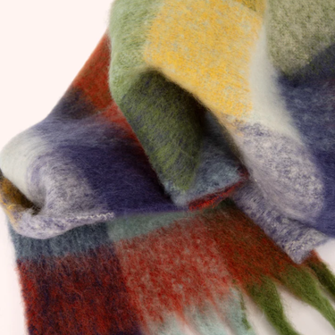 Close-up of a colorful plaid fabric with a white background