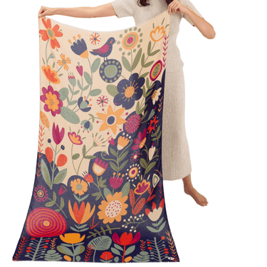 Person holding a colorful floral scarf with a white background