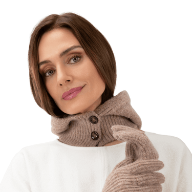 Woman wearing a brown knitted scarf and gloves on a white background