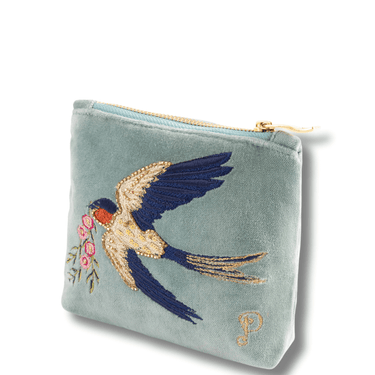 Light blue pouch with embroidered swallow and flowers on a white background