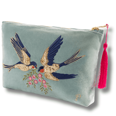 Light blue pouch with embroidered birds and flowers, featuring a pink tassel on a white background.