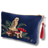 Navy blue pouch with owl and mushroom design and red tassel on a white background
