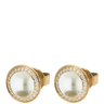 Gold rings with pearl-like centers and diamond-studded bezels on a white background
