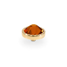 A single faceted amber-orange crystal gemstone set in a gold-toned bezel setting, photographed on a clean white background.