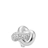 A polished silver-toned knot ring featuring a pavé-set round diamond cluster on one of the loops, photographed against a solid white background.