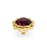 A gold-plated ring post or connector featuring a faceted dark red gemstone in a scalloped, flower-like setting, shown on a plain white background.