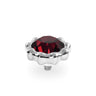 A silver-toned metal ring setting with a scalloped edge and a faceted deep red gemstone, shown on a clean white background.