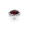 A silver-toned metal snap button featuring a faceted, scalloped deep red gemstone, shown on a clean white background.