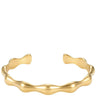 A polished gold open cuff bracelet with a wavy, organic wavy border, displayed on a clean white background.
