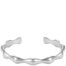 A polished silver open cuff bracelet with a wavy, organic contour, shown against a plain white background.