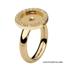 Gold ring with diamond accents on a white background