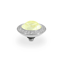 Decorative knob with a yellow gemstone and crystal trim on a white background