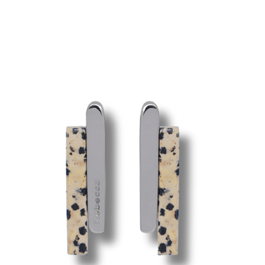 Two earrings with a spotted pattern on a white background